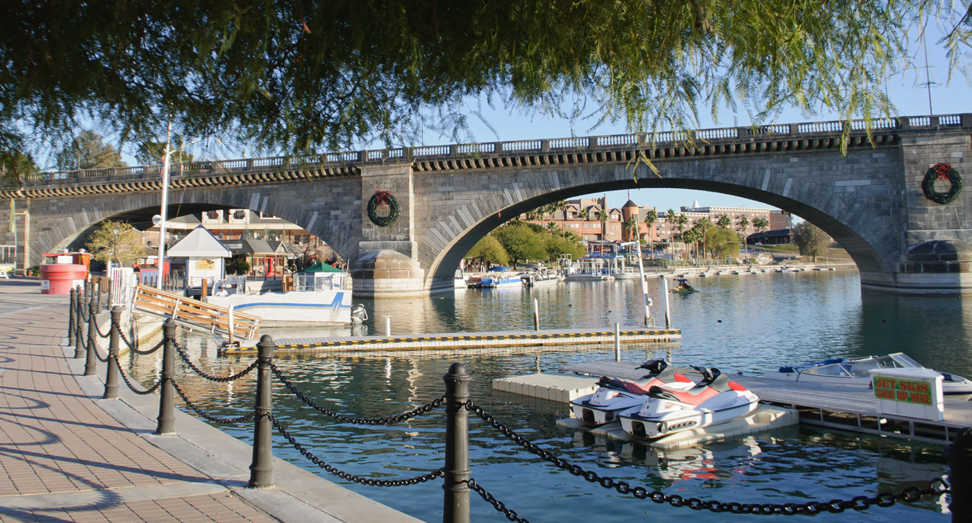 Calm Bridgewater Channel with London Bridge and moored boats